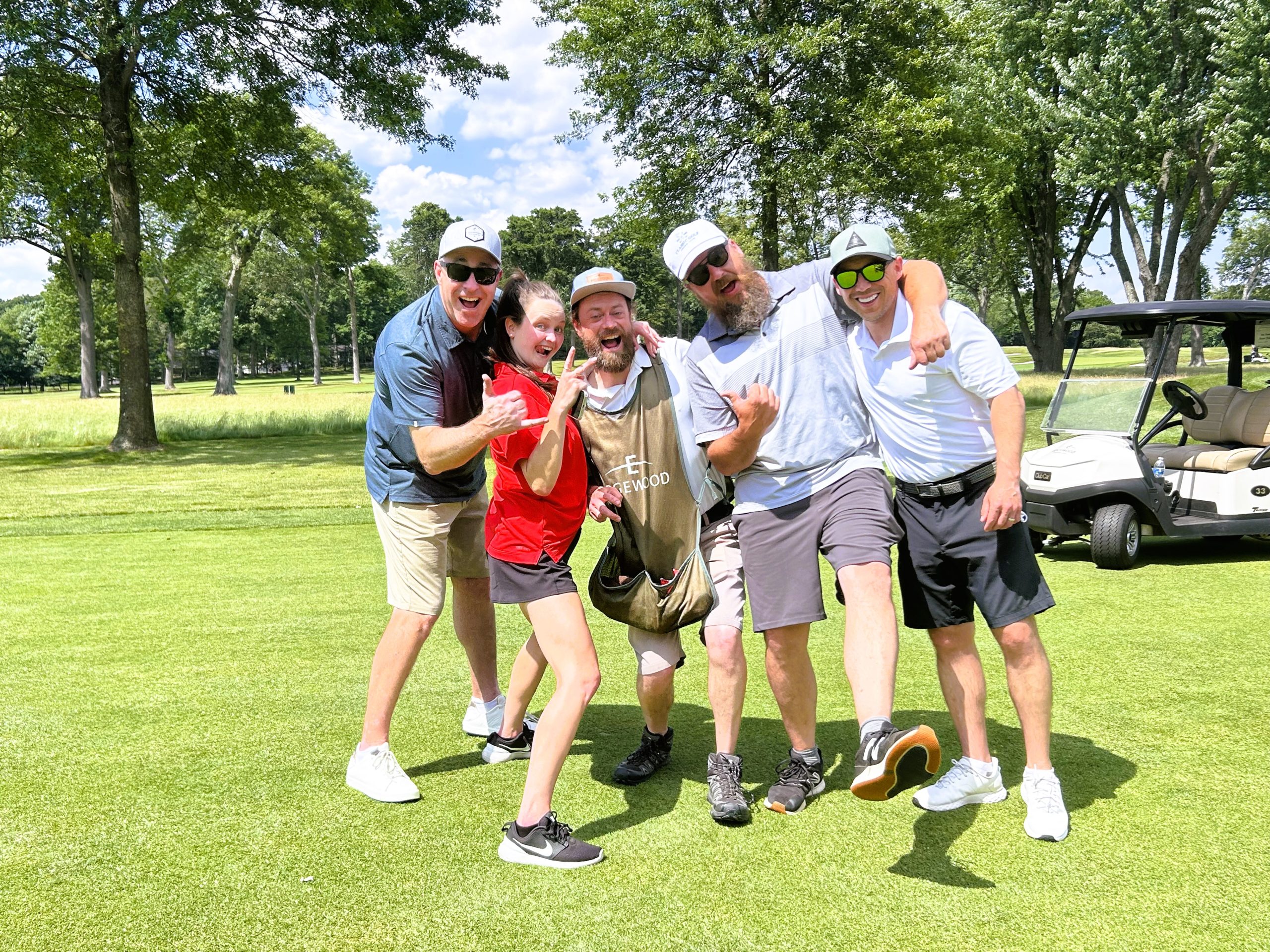 golf foursome with caddy