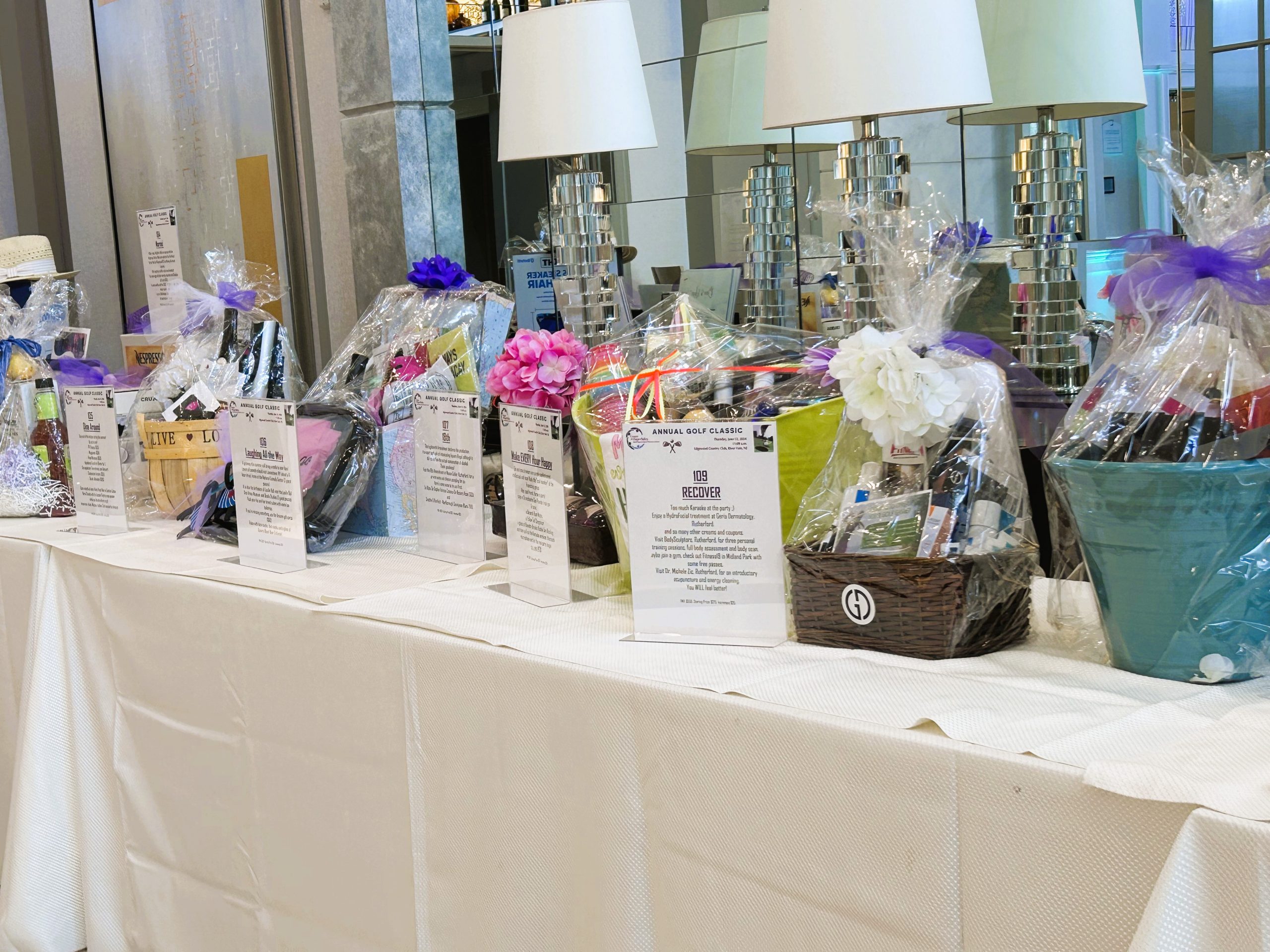 silent auction table with gift baskets