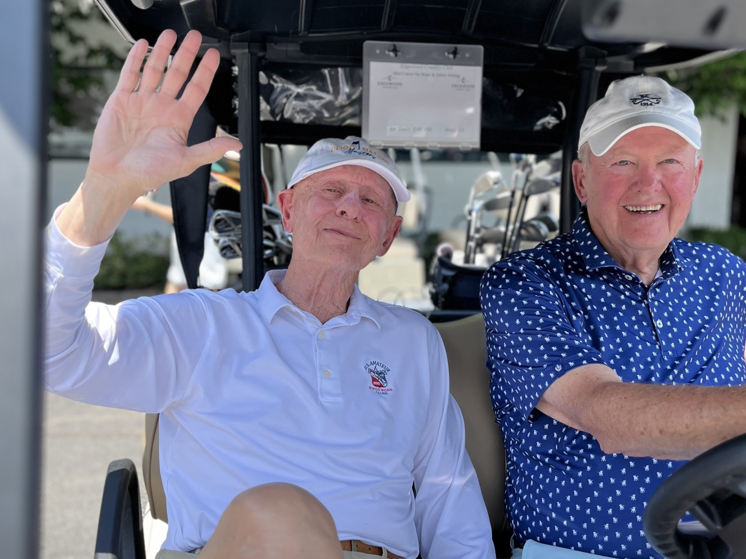 golf attendees in golf cart