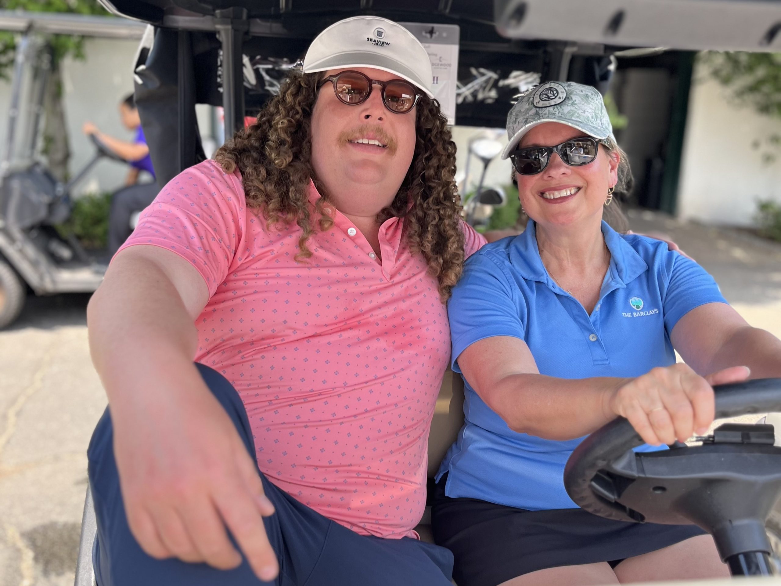 golf attendees in golf cart